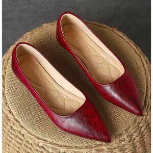 Red snakeskin print point toe flats